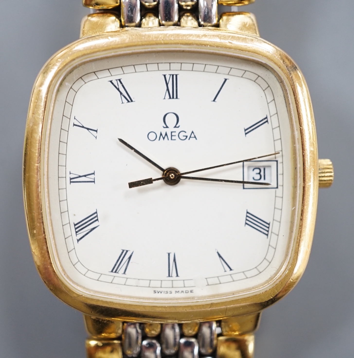 A gentleman's steel and gold plated Omega De Ville quartz wrist watch, on gold plated and steel Omega bracelet, case diameter 31mm, no box or papers.